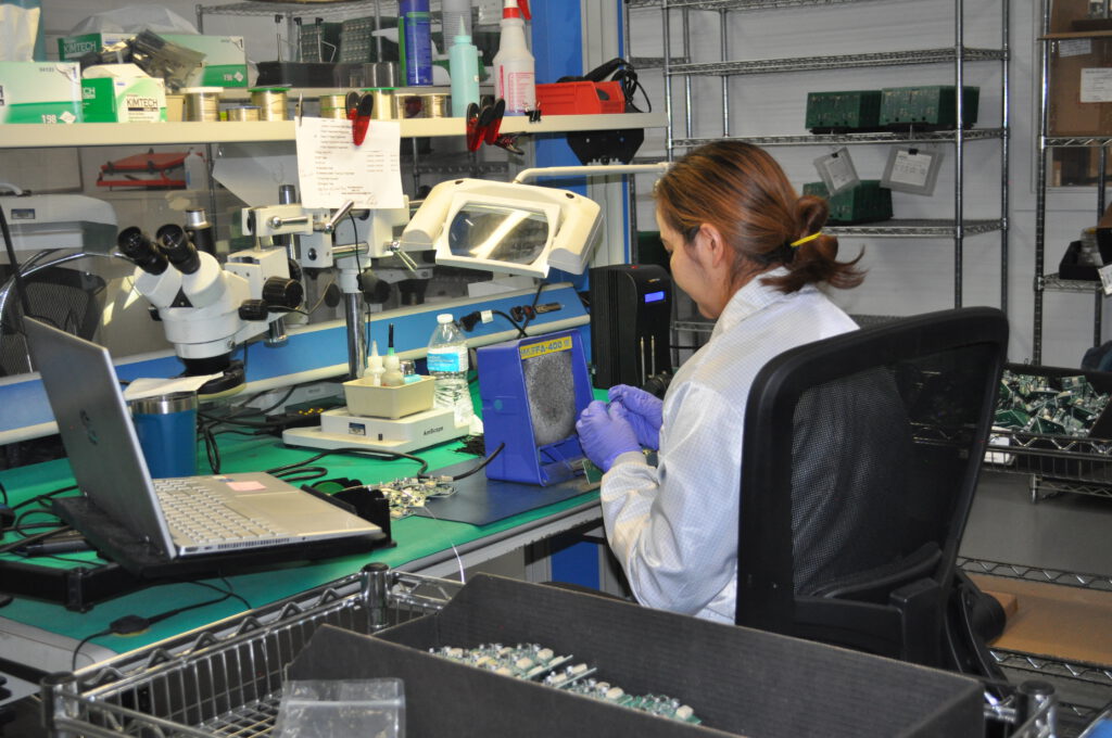 Nova Engineering Employee working at Denver PCB assembly.